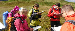 Group learning to navigate on a Mountaineering Scotland skills course
