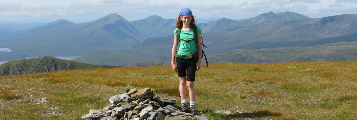 Young girl on mountain top