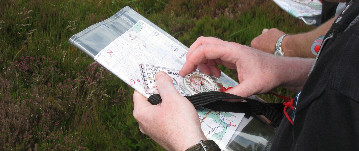 Practicing navigation skills with a map and compass