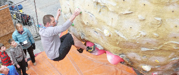 Going through an overhang on an indoor climbing wall