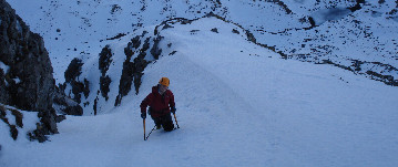 Hill walker and dog enjoying the view in the Scottish Highlands